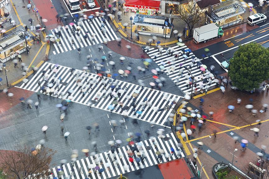 Aerial view of crowds crossing the famous Shibuya Crossing crosswalks (Shutterstock)